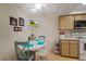 Bright kitchen features a breakfast nook and wood cabinets at 8350 High Point Cir # 3, Port Richey, FL 34668