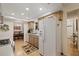 White appliances and wood cabinets highlight this eat-in kitchen at 8350 High Point Cir # 3, Port Richey, FL 34668