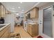 Kitchen with wood cabinets, white appliances, and a breakfast nook at 8350 High Point Cir # 3, Port Richey, FL 34668