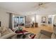 Living room with hardwood floors, comfortable seating, and access to a sunroom at 8350 High Point Cir # 3, Port Richey, FL 34668