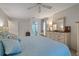 Main bedroom with king bed and ensuite bathroom access at 8350 High Point Cir # 3, Port Richey, FL 34668