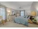 Main bedroom with a king-size bed and dresser at 8350 High Point Cir # 3, Port Richey, FL 34668