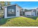 Eye-catching curb appeal with a newly painted exterior and well-manicured lawn at 8806 Avondale Ln, Hudson, FL 34667