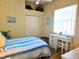 Bedroom with a double bed, desk, and built-in closet at 9250 Alcott Way, Trinity, FL 34655
