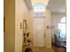 Inviting entryway with a console table and decorative mirror at 9250 Alcott Way, Trinity, FL 34655
