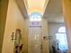 Bright entryway with high ceilings and decorative accents at 9250 Alcott Way, Trinity, FL 34655