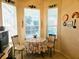 Charming breakfast nook in the kitchen with a floral tablecloth at 9250 Alcott Way, Trinity, FL 34655