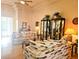 Living room with hardwood floors, two sofas and display cabinets at 9250 Alcott Way, Trinity, FL 34655