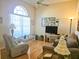 Bright and airy living room with hardwood floors and comfortable seating at 9250 Alcott Way, Trinity, FL 34655