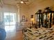 Spacious living room featuring hardwood floors, two sofas and display cabinets at 9250 Alcott Way, Trinity, FL 34655