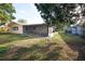 House with covered patio and fenced backyard at 9321 Mansard Ln, Port Richey, FL 34668