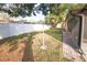 Spacious backyard with grassy area and screened patio at 9321 Mansard Ln, Port Richey, FL 34668