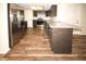 Modern kitchen with stainless steel refrigerator and granite island at 9321 Mansard Ln, Port Richey, FL 34668
