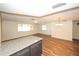 Kitchen with granite countertops and dark cabinets at 9321 Mansard Ln, Port Richey, FL 34668
