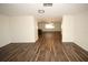 Open concept living area with hardwood floors at 9321 Mansard Ln, Port Richey, FL 34668