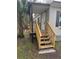 Wooden steps leading up to a covered front porch at 9400 Loras St, New Port Richey, FL 34654