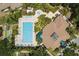 Aerial view of community pool, hot tub, and clubhouse at 1005 Mizzen Ct, Tarpon Springs, FL 34689