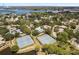 Aerial view of community tennis courts and pool at 1005 Mizzen Ct, Tarpon Springs, FL 34689