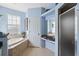 Bathroom with shower and garden tub at 1005 Mizzen Ct, Tarpon Springs, FL 34689