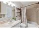 Clean bathroom with tub, shower, and updated vanity at 1005 Mizzen Ct, Tarpon Springs, FL 34689