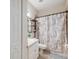 Clean bathroom with tub, shower, and updated vanity at 1005 Mizzen Ct, Tarpon Springs, FL 34689