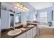 Spa-like bathroom with soaking tub and double sinks at 1005 Mizzen Ct, Tarpon Springs, FL 34689