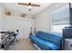 Bedroom with a futon, desk, and ample closet space at 1005 Mizzen Ct, Tarpon Springs, FL 34689