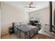 Guest bedroom with TV and built-in workspace at 1005 Mizzen Ct, Tarpon Springs, FL 34689