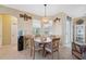 Cozy breakfast nook with a round table and wicker pendant light at 1005 Mizzen Ct, Tarpon Springs, FL 34689