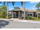 Community center with covered entryway and landscaping at 1005 Mizzen Ct, Tarpon Springs, FL 34689