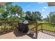 Deck with built-in grill and backyard access at 1005 Mizzen Ct, Tarpon Springs, FL 34689
