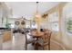 Casual dining area with round table and chairs, adjacent to living room at 1005 Mizzen Ct, Tarpon Springs, FL 34689