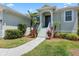 Landscaped entryway with stairs leading to front door at 1005 Mizzen Ct, Tarpon Springs, FL 34689