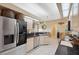 Modern kitchen with stainless steel appliances and granite countertops at 1005 Mizzen Ct, Tarpon Springs, FL 34689