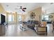 Open living room with a comfortable couch and views to the entryway and dining area at 1005 Mizzen Ct, Tarpon Springs, FL 34689