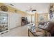 Living room with a cozy seating area and built-in shelving at 1005 Mizzen Ct, Tarpon Springs, FL 34689