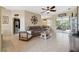 Spacious living room featuring a comfortable leather couch and tile flooring at 1005 Mizzen Ct, Tarpon Springs, FL 34689