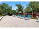 Relaxing pool deck with lounge chairs and patio tables at 1005 Mizzen Ct, Tarpon Springs, FL 34689