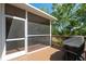 Screened porch with deck and backyard access at 1005 Mizzen Ct, Tarpon Springs, FL 34689