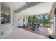 Relaxing screened porch with patio furniture and lake view at 1005 Mizzen Ct, Tarpon Springs, FL 34689