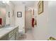 Clean bathroom with granite countertop, toilet and shower at 10451 Keystone St, Spring Hill, FL 34608