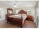 Spacious main bedroom with wood furniture and plenty of natural light at 10451 Keystone St, Spring Hill, FL 34608