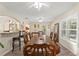 Dining room with large table, hardwood floors and lots of natural light at 10451 Keystone St, Spring Hill, FL 34608