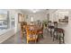 Bright dining room with hardwood floors and access to kitchen at 10451 Keystone St, Spring Hill, FL 34608