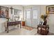Bright entryway with decorative console table and religious artwork at 10451 Keystone St, Spring Hill, FL 34608