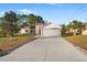 House exterior with driveway and landscaping at 10451 Keystone St, Spring Hill, FL 34608