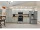 Modern kitchen with stainless steel appliances and granite countertops at 10451 Keystone St, Spring Hill, FL 34608
