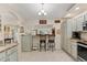 Kitchen with light cabinets, granite countertops, and stainless steel appliances at 10451 Keystone St, Spring Hill, FL 34608