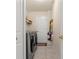 Laundry room with washer, dryer and storage shelves at 10451 Keystone St, Spring Hill, FL 34608