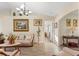 Living room with light colored sofas and decorative accents at 10451 Keystone St, Spring Hill, FL 34608